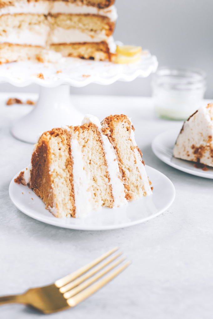 This spectacular Vegan Lemon Cream Layer Cake is a delectable cake for the most special of occasions. Enjoy the creamy lemon buttercream sandwiched between layers of homemade vanilla cake. NeuroticMommy.com #vegan #cake #easter