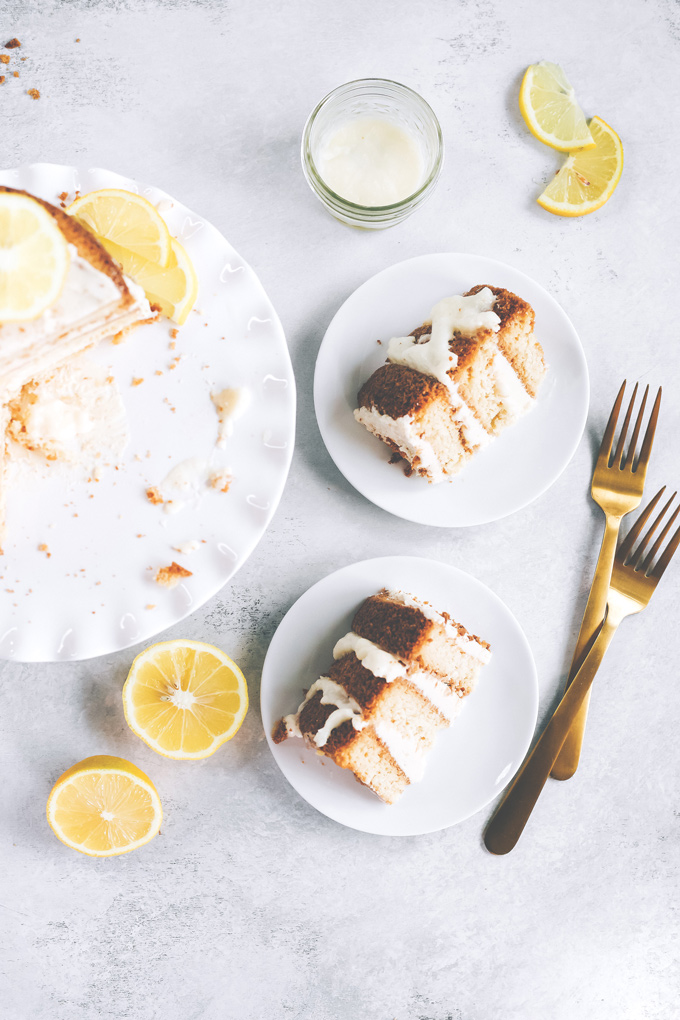 This spectacular Vegan Lemon Cream Layer Cake is a delectable cake for the most special of occasions. Enjoy the creamy lemon buttercream sandwiched between layers of homemade vanilla cake. NeuroticMommy.com #vegan #cake #easter