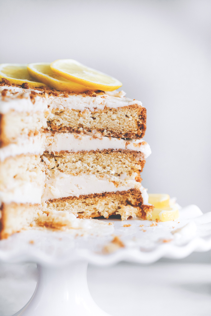 This spectacular Vegan Lemon Cream Layer Cake is a delectable cake for the most special of occasions. Enjoy the creamy lemon buttercream sandwiched between layers of homemade vanilla cake. NeuroticMommy.com #vegan #cake #easter