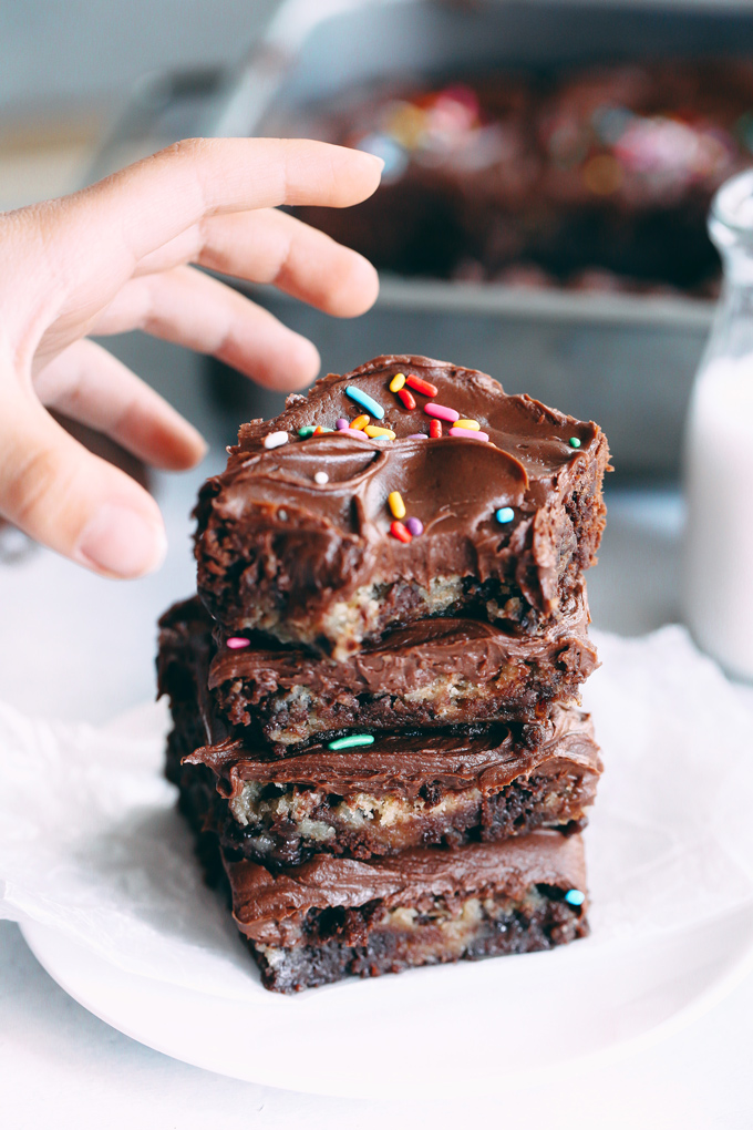 Vegan Magic Cookie Brownie Bars are my go to lazy mom make. They have double the delicousness where cookie dough meets brownie becoming one. Topped with a delicious chocolate ganache and sprinkles! NeuroticMommy.com