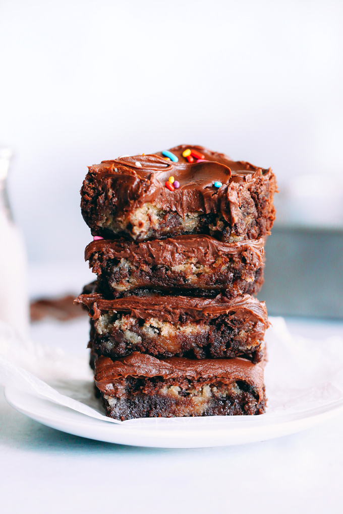 Vegan Magic Cookie Brownie Bars are my go to lazy mom make. They have double the delicousness where cookie dough meets brownie becoming one. Topped with a delicious chocolate ganache and sprinkles! NeuroticMommy.com