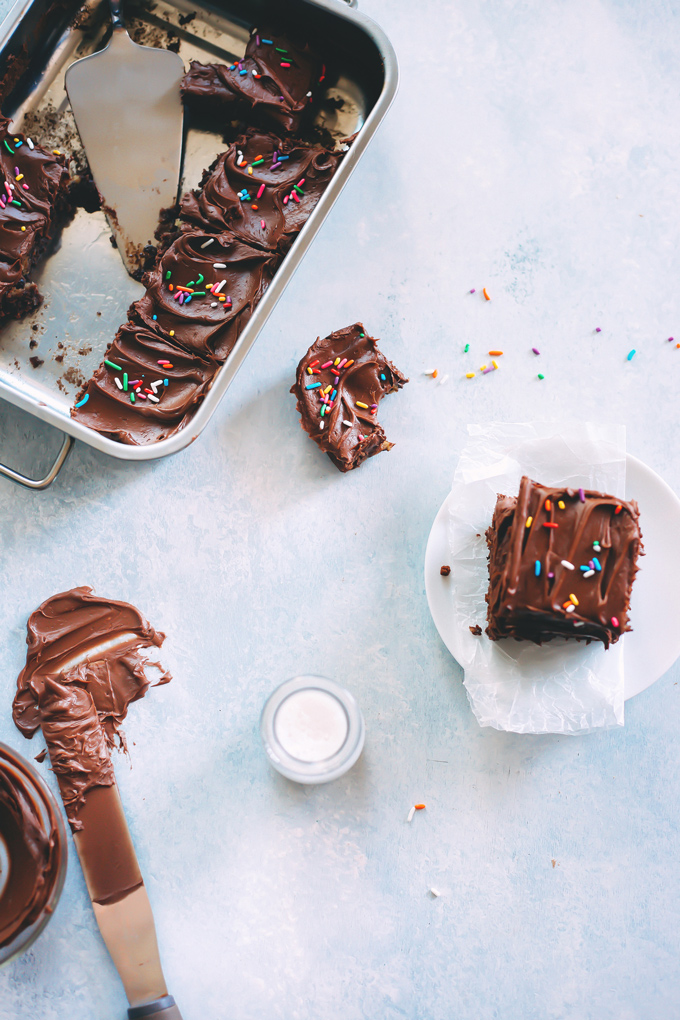Vegan Magic Cookie Brownie Bars are my go to lazy mom make. They have double the delicousness where cookie dough meets brownie becoming one. Topped with a delicious chocolate ganache and sprinkles! NeuroticMommy.com