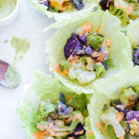 Roasted Cauliflower Cabbage Wraps - Rainbow cauliflower roasted then wrapped in savoy cabbage. Drizzle on some avocado cream or vegan thousand island dressing for added flavor. Super colorful, super delicious, super healthy. NeuroticMommy.com #cabbage #cauliflower #wraps #vegan