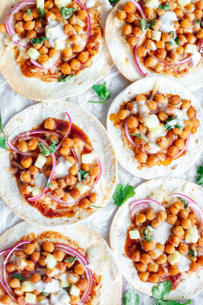 Vegan BBQ Chickpea Pizzas - BBQ coated chickpeas on top of melty vegan mozzarella cheese and loaded with so much goodness, makes this vegan pizza night a keeper! NeuroticMommy.com #veganpizza