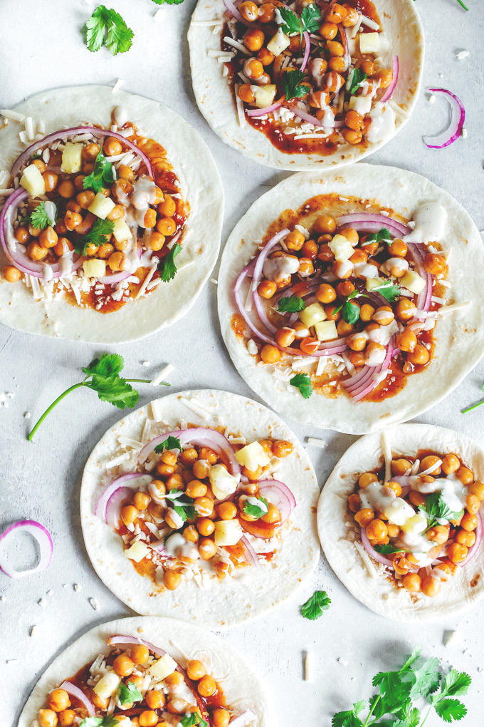 Vegan BBQ Chickpea Pizzas - BBQ coated chickpeas on top of melty vegan mozzarella cheese and loaded with so much goodness, makes this vegan pizza night a keeper! NeuroticMommy.com #veganpizza