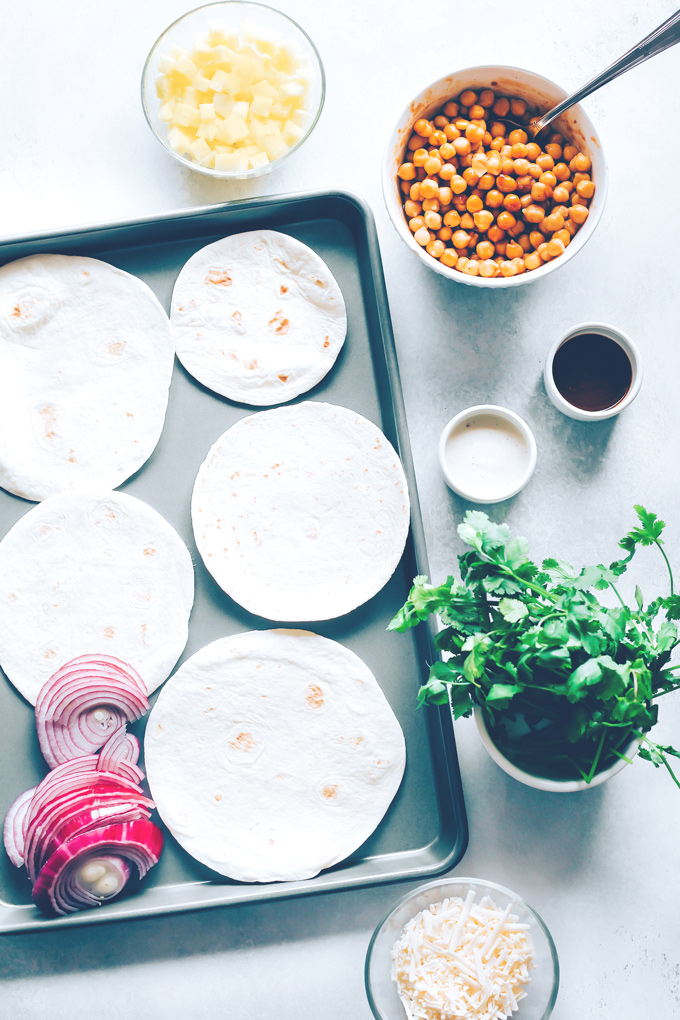 Vegan BBQ Chickpea Pizzas - BBQ coated chickpeas on top of melty vegan mozzarella cheese and loaded with so much goodness, makes this vegan pizza night a keeper! NeuroticMommy.com #veganpizza