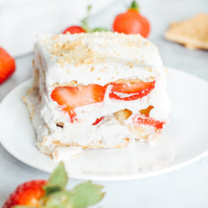 Vegan Strawberry Banana Icebox Cake - One of my fave spring/summer desserts. Generously filled with coconut whip cream and fresh strawberries and bananas this delightful dessert is easy, super tasty, refreshing, and somewhat on the healthier side! NeuroticMommy.com #vegan #spring #iceboxcake