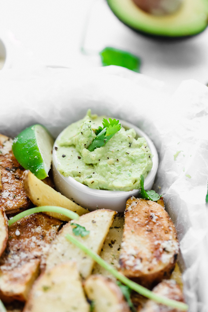 Potato Wedges with Avocado Ranch - a healthy alternative to french fries, enjoy these baked and lightly salted wedges that pair perfectly with vegan avocado ranch to dip! NeuroticMommy.com #veganfries #bakedfries #avocado