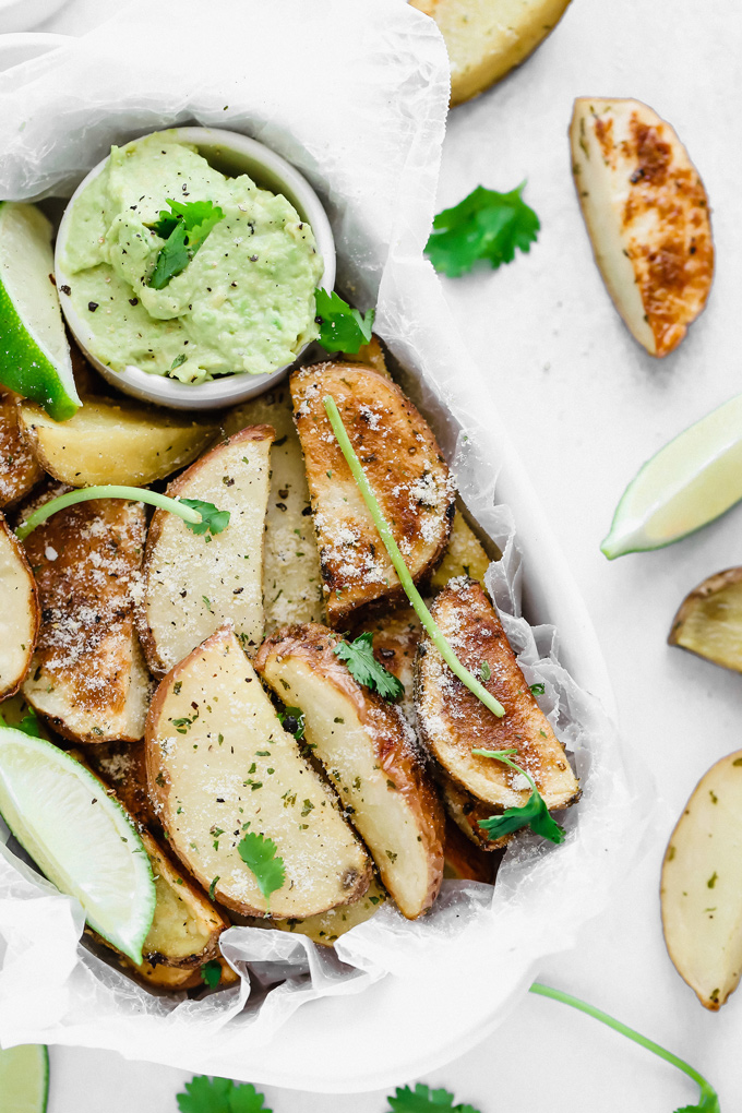 Potato Wedges with Avocado Ranch - a healthy alternative to french fries, enjoy these baked and lightly salted wedges that pair perfectly with vegan avocado ranch to dip! NeuroticMommy.com #veganfries #bakedfries #avocado