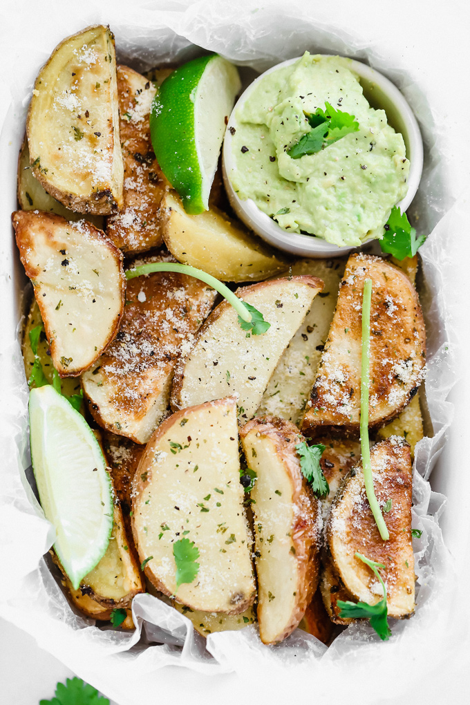Potato Wedges with Avocado Ranch - a healthy alternative to french fries, enjoy these baked and lightly salted wedges that pair perfectly with vegan avocado ranch to dip! NeuroticMommy.com #veganfries #bakedfries #avocado