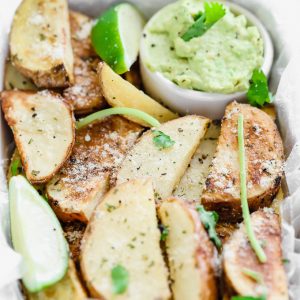 Potato Wedges with Avocado Ranch - a healthy alternative to french fries, enjoy these baked and lightly salted wedges that pair perfectly with vegan avocado ranch to dip! NeuroticMommy.com #veganfries #bakedfries #avocado