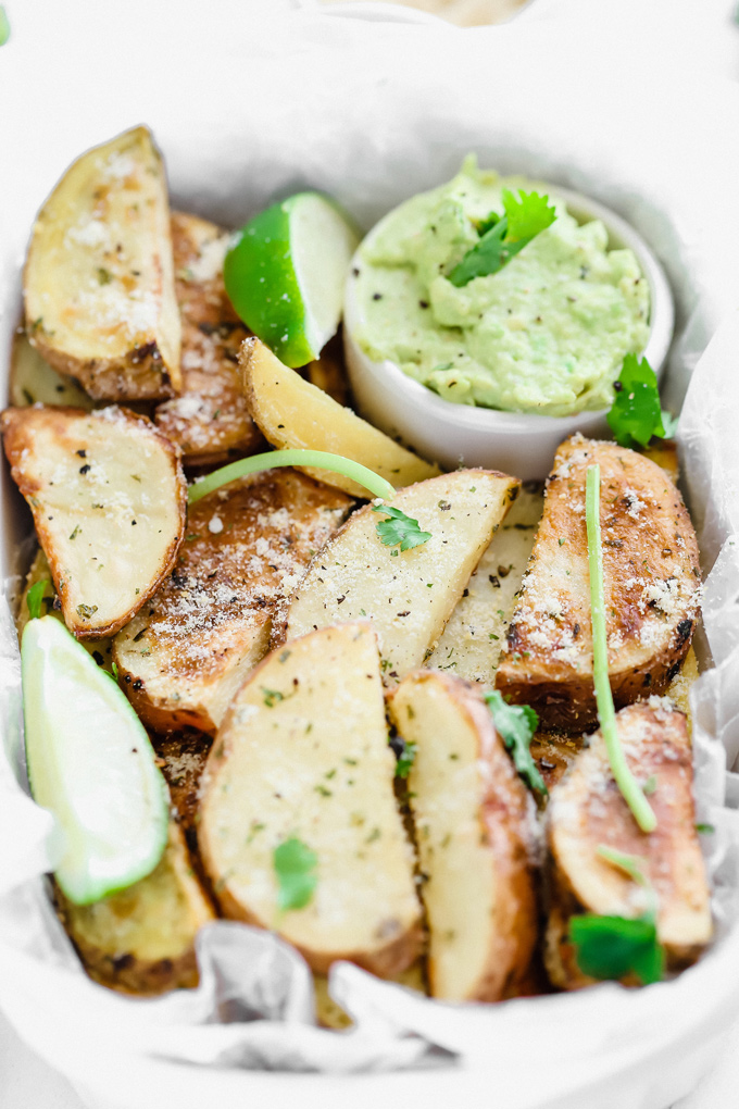 Potato Wedges with Avocado Ranch - a healthy alternative to french fries, enjoy these baked and lightly salted wedges that pair perfectly with vegan avocado ranch to dip! NeuroticMommy.com #veganfries #bakedfries #avocado