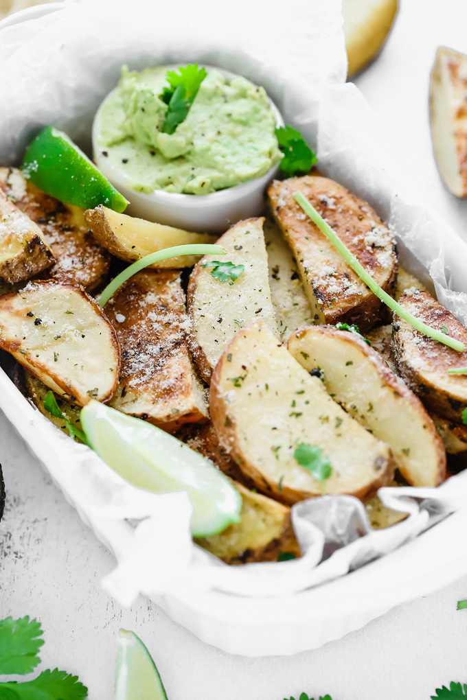 Potato Wedges with Avocado Ranch - a healthy alternative to french fries, enjoy these baked and lightly salted wedges that pair perfectly with vegan avocado ranch to dip! NeuroticMommy.com #veganfries #bakedfries #avocado