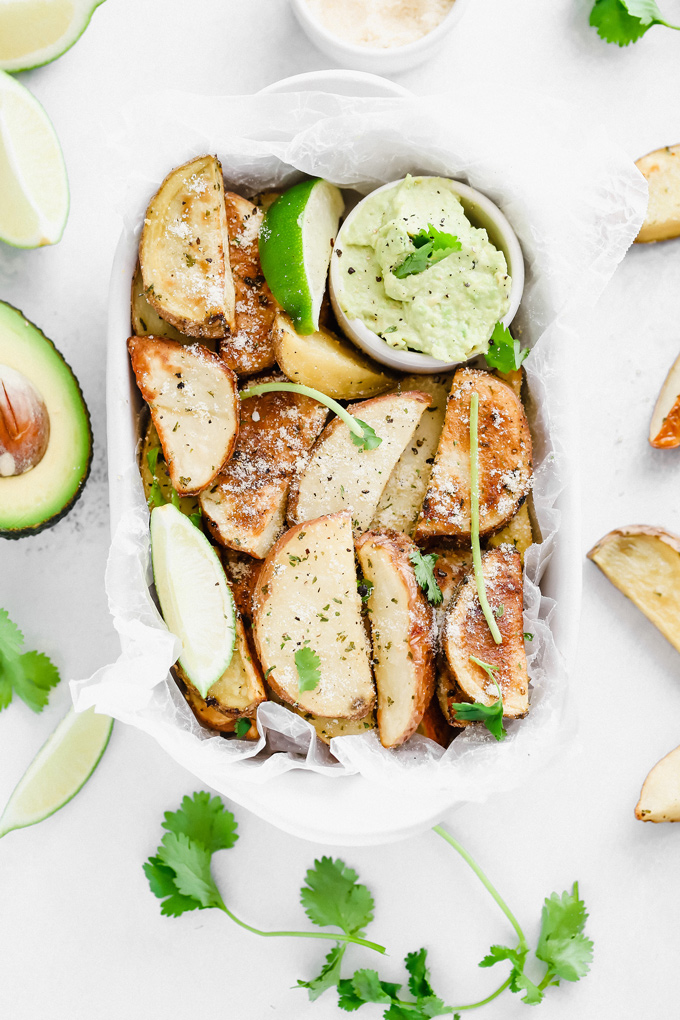 Potato Wedges with Avocado Ranch - a healthy alternative to french fries, enjoy these baked and lightly salted wedges that pair perfectly with vegan avocado ranch to dip! NeuroticMommy.com #veganfries #bakedfries #avocado