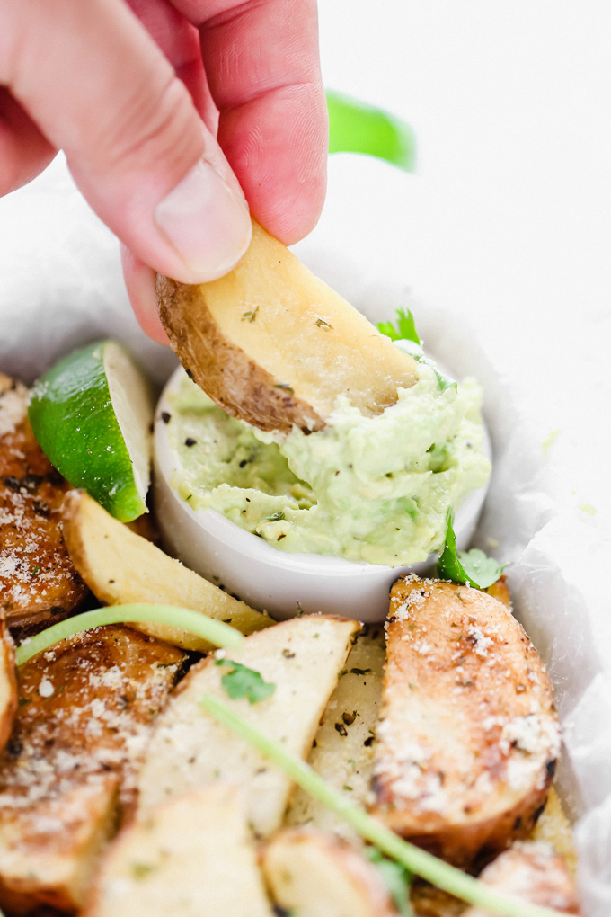 Potato Wedges with Avocado Ranch - a healthy alternative to french fries, enjoy these baked and lightly salted wedges that pair perfectly with vegan avocado ranch to dip! NeuroticMommy.com #veganfries #bakedfries #avocado