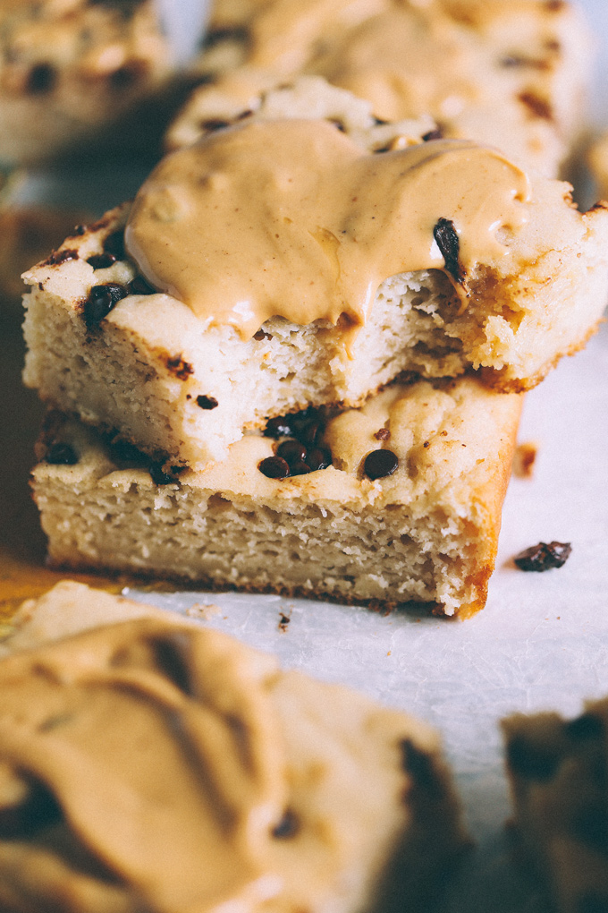Vegan Sheet Pan Chocolate Peanut Butter Pancakes - Taking breakfast to a whole new level with these decked out pancake bars smothered with vegan white chocolate peanut butter and dazzled with dairy free chocolate chips. NeuroticMommy.com #vegan #pancakes #sheetpan