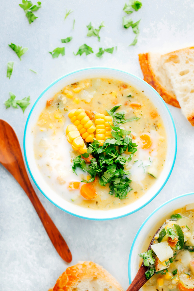 Creamy vegan chowder loaded with corn, zucchini and other herbs and veggies. This lightened up version is perfect for summer. NeuroticMommy.com #vegan