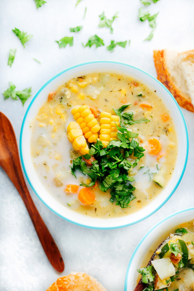 Creamy vegan chowder loaded with corn, zucchini and other herbs and veggies. This lightened up version is perfect for summer. NeuroticMommy.com #vegan