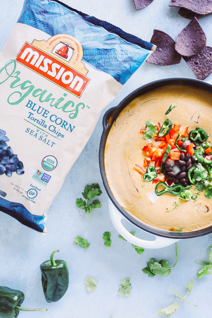 Vegan Poblano Black Bean Queso Dip is anything but basic. Loaded with all sorts of fresh goodness turned into a creamy, melty, luscious cheese dip perfect for all your dunking needs. NeuroticMommy.com #veganqueso
