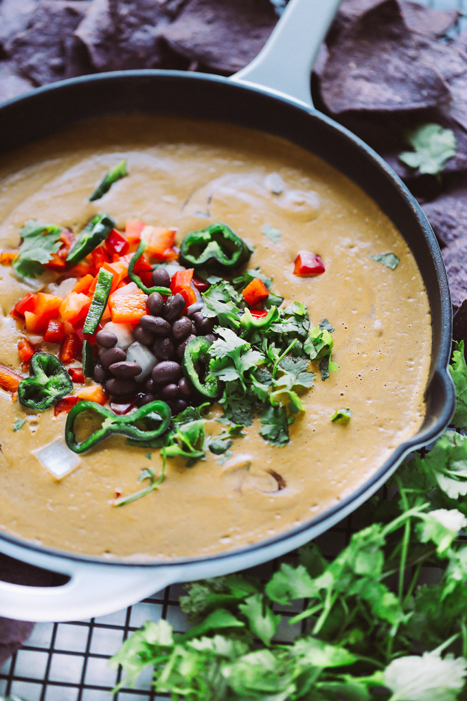 Vegan Poblano Black Bean Queso Dip is anything but basic. Loaded with all sorts of fresh goodness turned into a creamy, melty, luscious cheese dip perfect for all your dunking needs. NeuroticMommy.com #veganqueso #dip