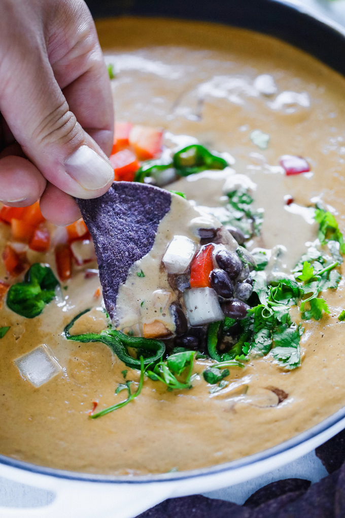 Vegan Poblano Black Bean Queso Dip is anything but basic. Loaded with all sorts of fresh goodness turned into a creamy, melty, luscious cheese dip perfect for all your dunking needs. NeuroticMommy.com #veganqueso #dip