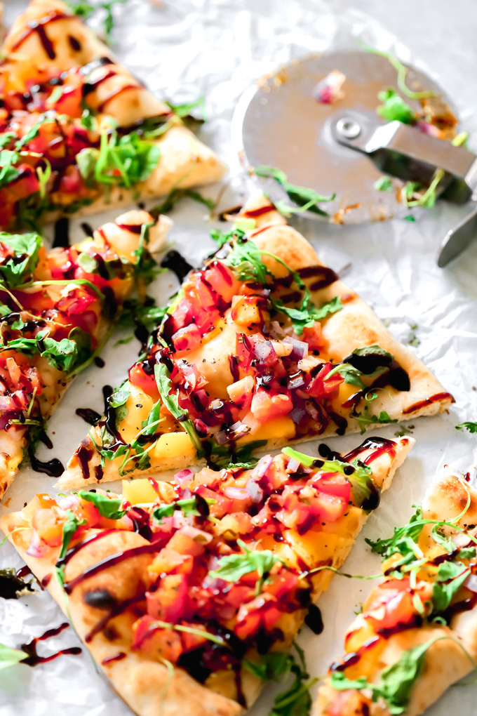 Vegan Bruschetta and Arugula Flatbread Pizza with a Balsamic glaze - Delicious easy recipe with immense flavor. Enjoy this homemade flatbread pizza using fresh bruschetta, arugula, vegan cheese, and a sweet balsamic glaze. NeuroticMommy.com #veganpizza