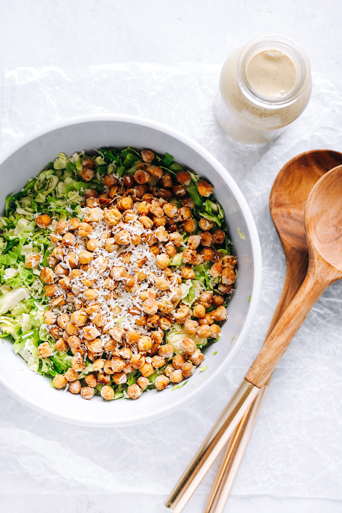 Vegan Brussels Sprout Caesar Salad with Chickpea Croutons - Such a fun way to enjoy a classic fave. With their anti-inflammatory properties brussels sprouts are one superfood to add to your weekly rotations. NeuroticMommy.com #vegan #caesarsalad #healthy