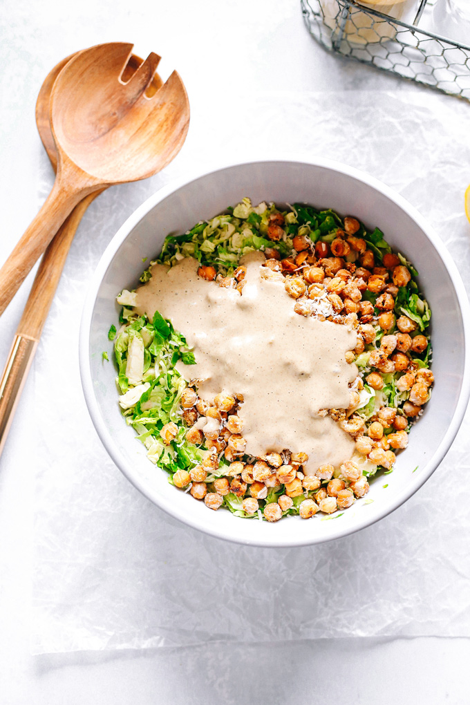 Vegan Brussels Sprout Caesar Salad with Chickpea Croutons - Such a fun way to enjoy a classic fave. With their anti-inflammatory properties brussels sprouts are one superfood to add to your weekly rotations. NeuroticMommy.com #vegan #caesarsalad #healthy