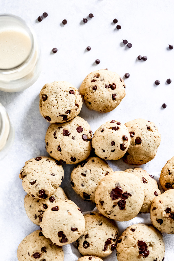 The Easiest Vegan Chocolate Chip Cookies - With a cake like center, these cookies have melty chocolate chips in every bite. No waiting for the dough to set, just whip these together with the easiest ingredients, enjoy raw or cooked and that's it! NeuroticMommy.com #vegancookies #chocolatechips #christmascookies