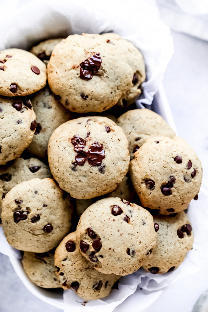 The Easiest Vegan Chocolate Chip Cookies - With a cake like center, these cookies have melty chocolate chips in every bite. No waiting for the dough to set, just whip these together with the easiest ingredients, enjoy raw or cooked and that's it! NeuroticMommy.com #vegancookies #chocolatechips #christmascookies