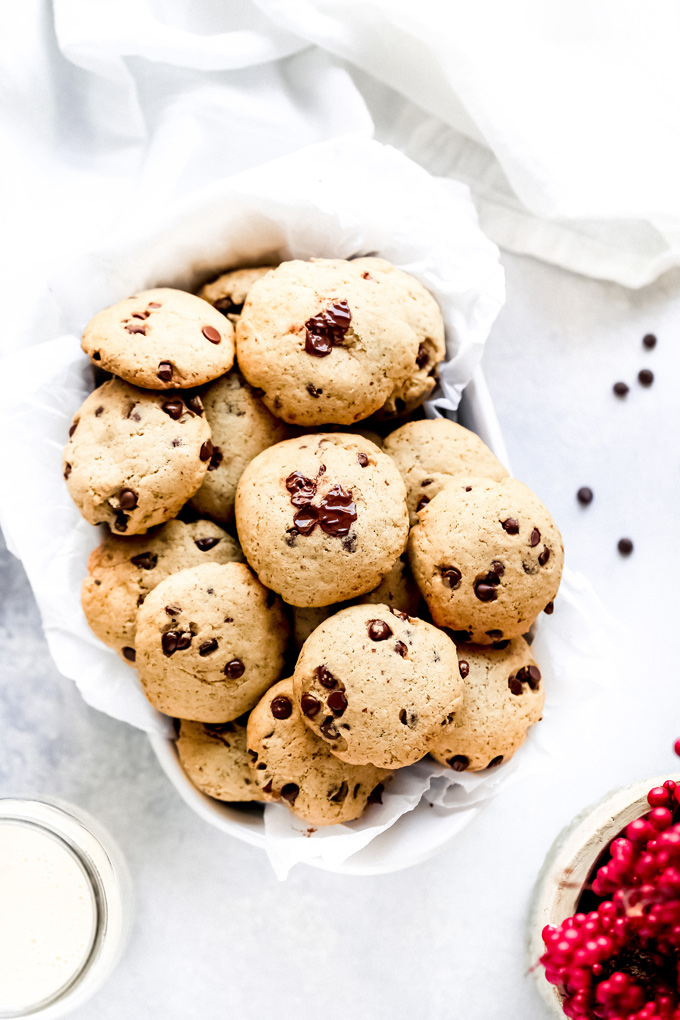 The Easiest Vegan Chocolate Chip Cookies - With a cake like center, these cookies have melty chocolate chips in every bite. No waiting for the dough to set, just whip these together with the easiest ingredients, enjoy raw or cooked and that's it! NeuroticMommy.com #vegancookies #chocolatechips #christmascookies