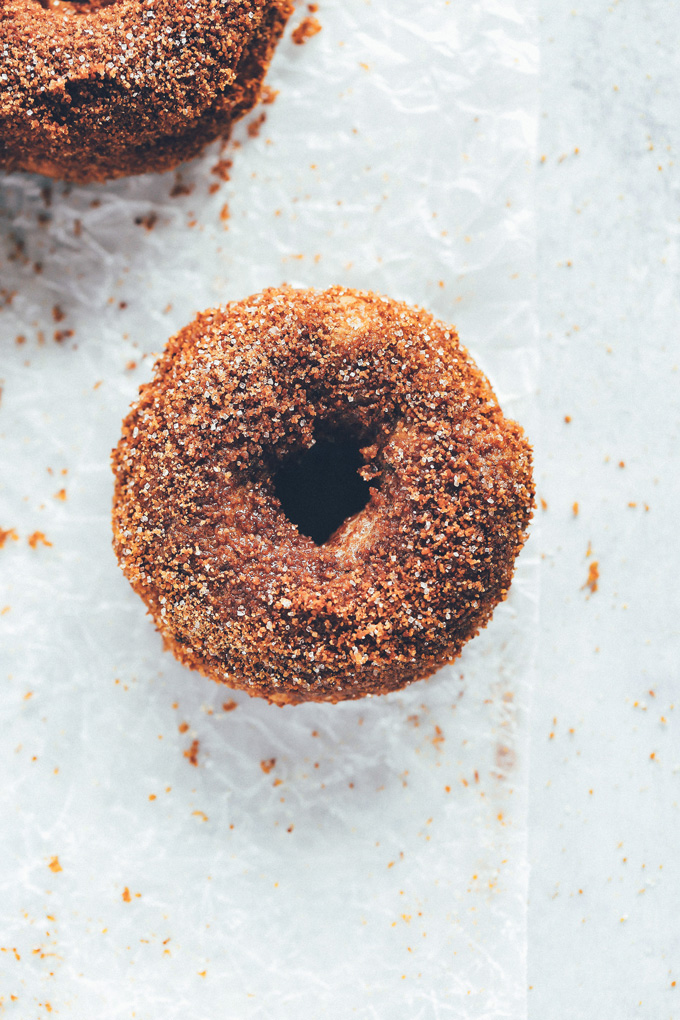 They're soft, fluffy, dense and moist all at the same time. The outside is coated in a sticky delicious mix of brown sugar, coconut sugar, regular sugar, cinnamon, and a dash of pumpkin spice. So Good! NeuroticMommy.com #vegandoughnuts #veganchristmas