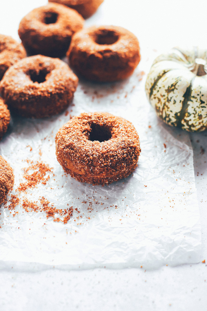 They're soft, fluffy, dense and moist all at the same time. The outside is coated in a sticky delicious mix of brown sugar, coconut sugar, regular sugar, cinnamon, and a dash of pumpkin spice. So Good! NeuroticMommy.com #vegandoughnuts #veganchristmas