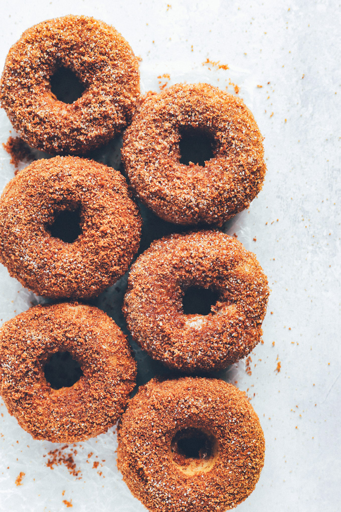 They're soft, fluffy, dense and moist all at the same time. The outside is coated in a sticky delicious mix of brown sugar, coconut sugar, regular sugar, cinnamon, and a dash of pumpkin spice. So Good! NeuroticMommy.com #vegandoughnuts #veganchristmas