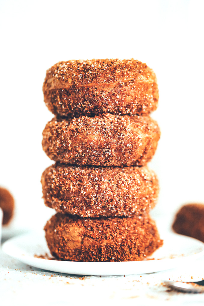 They're soft, fluffy, dense and moist all at the same time. The outside is coated in a sticky delicious mix of brown sugar, coconut sugar, regular sugar, cinnamon, and a dash of pumpkin spice. So Good! NeuroticMommy.com #vegandoughnuts #veganchristmas