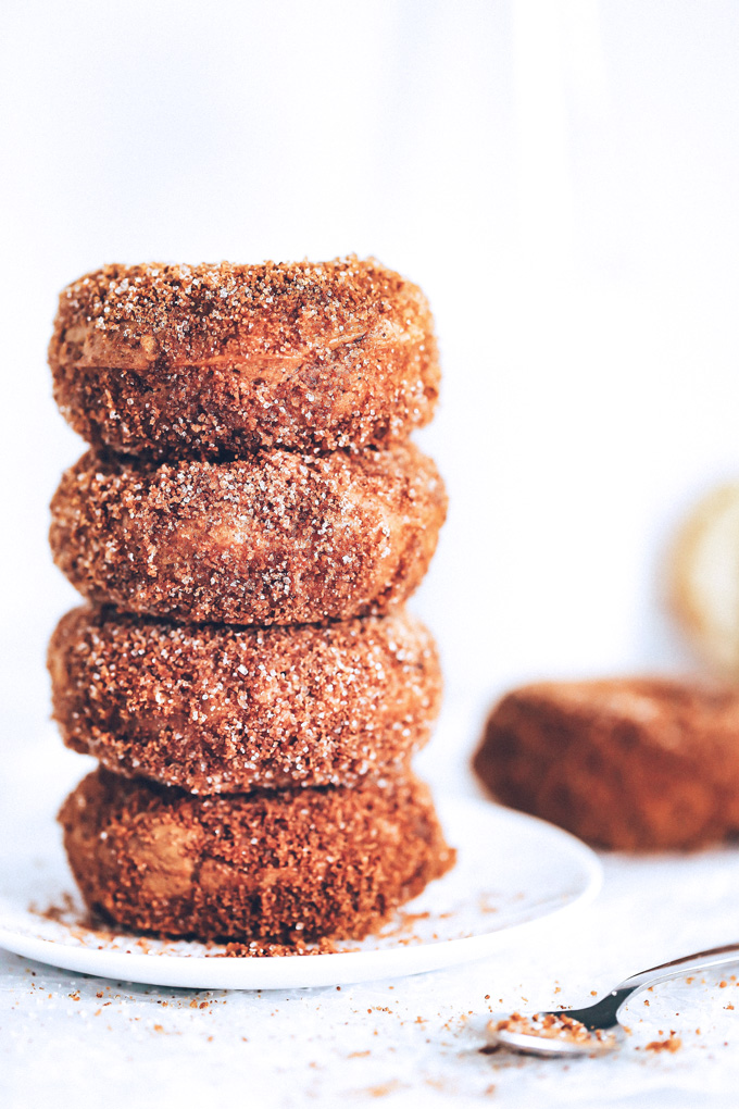 They're soft, fluffy, dense and moist all at the same time. The outside is coated in a sticky delicious mix of brown sugar, coconut sugar, regular sugar, cinnamon, and a dash of pumpkin spice. So Good! NeuroticMommy.com #vegandoughnuts #veganchristmas