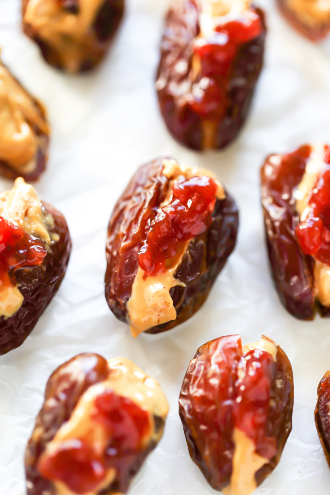 Peanut Butter and Jelly Stuffed Dates - Filled with creamy peanut butter and sweet strawberry jam, these are THE snack to have. Jam packed with goodness. NeuroticMommy.com #healthysnacks #stuffeddates
