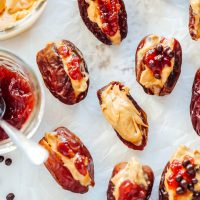 Peanut Butter and Jelly Stuffed Dates - Filled with creamy peanut butter and sweet strawberry jam, these are THE snack to have. Jam packed with goodness. NeuroticMommy.com #healthysnacks #stuffeddates