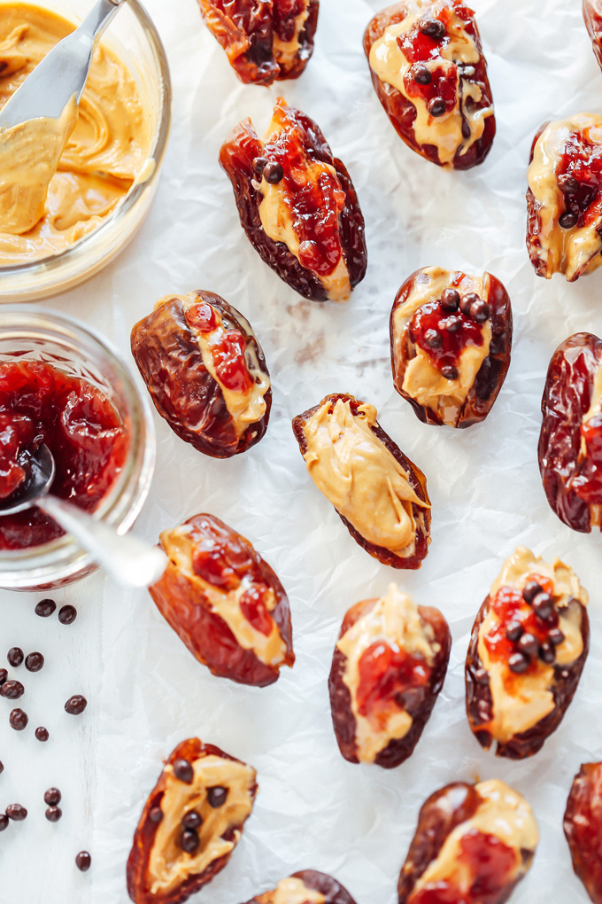 Peanut Butter and Jelly Stuffed Dates - Filled with creamy peanut butter and sweet strawberry jam, these are THE snack to have. Jam packed with goodness. NeuroticMommy.com #healthysnacks #stuffeddates