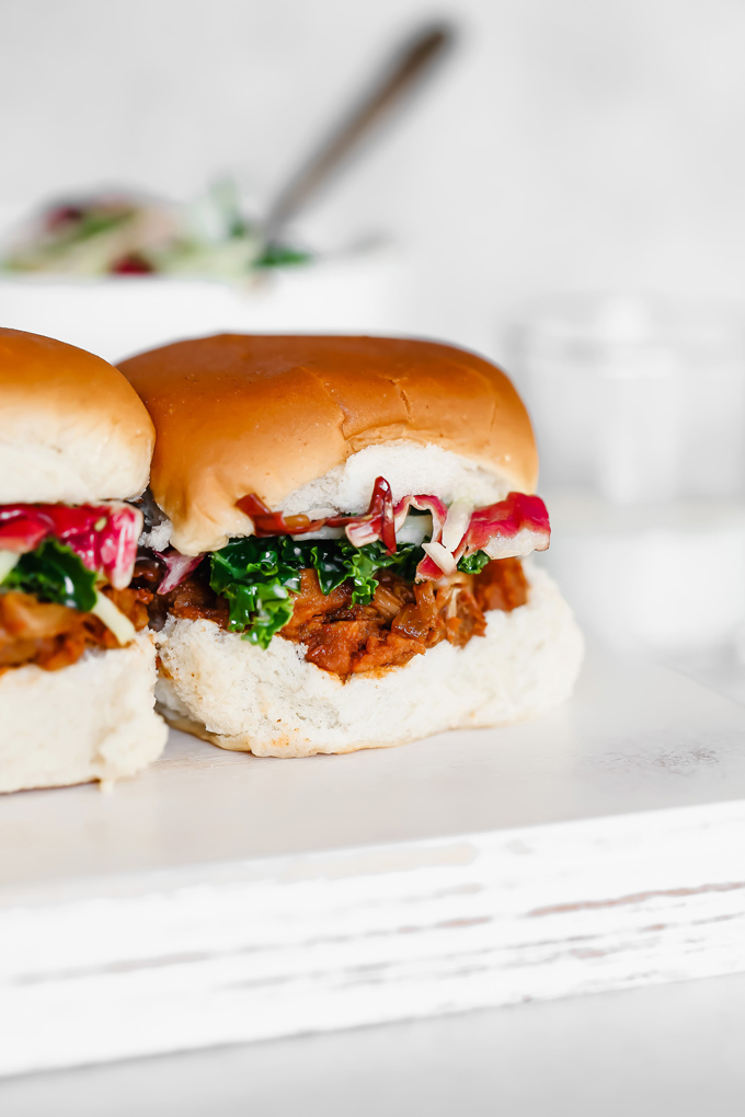 Vegan BBQ Jackfruit Sliders - These are so good. The jackfruit is super tender and it all sort of melts in your mouth. Paired with a cool coleslaw and option to meal prep. NeuroticMommy.com #vegansliders #bbqjackfruit