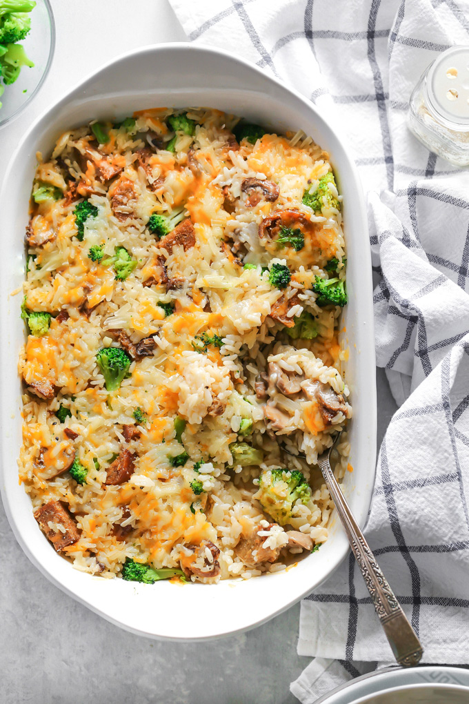 Vegan Cheesy Broccoli Sausage Rice Bake - is loaded with broccoli, rice, sausage, mushrooms and all finished off with a super melty cheesy topping. NeuroticMommy.com #vegandinner