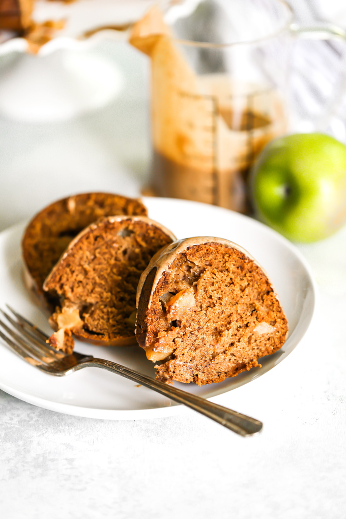 Almond Butter Apple Pudding Bundt Cake tastes like pudding, it's super fluffy and light with the perfect almond butter, date, caramel drizzle, making this all sorts of delicious. And it's Vegan. NeuroticMommy.com #vegancake