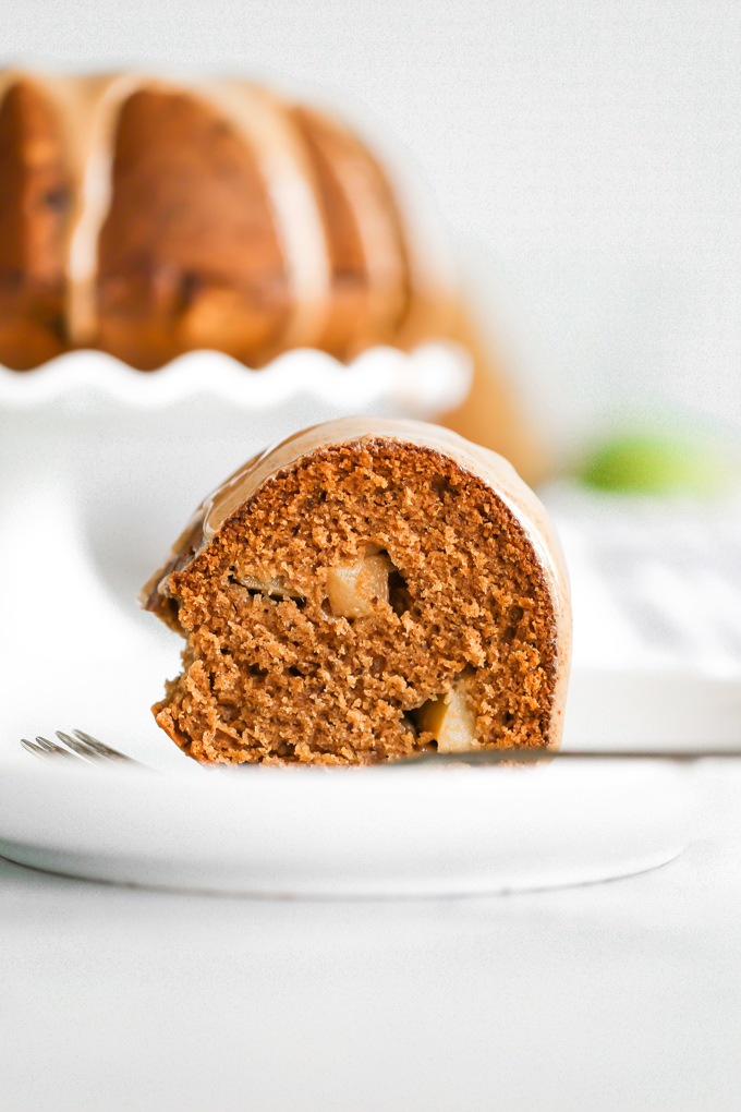 Almond Butter Apple Pudding Bundt Cake tastes like pudding, it's super fluffy and light with the perfect almond butter, date, caramel drizzle, making this all sorts of delicious. And it's Vegan. NeuroticMommy.com #vegancake