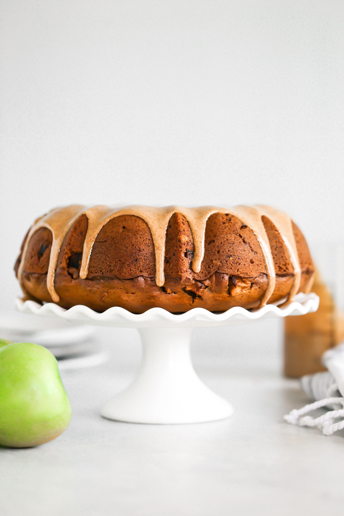 Almond Butter Apple Pudding Bundt Cake tastes like pudding, it's super fluffy and light with the perfect almond butter, date, caramel drizzle, making this all sorts of delicious. And it's Vegan. NeuroticMommy.com #vegancake