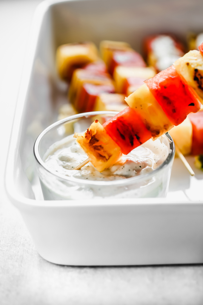 Grilled Watermelon and Pineapple Skewers - Juicy and sweet pineapple and watermelon grilled to perfection then drizzled in a refreshing Vegan Tzatziki sauce bringing you all the tropical, summer feels. NeuroticMommy.com #vegan #summersnacks