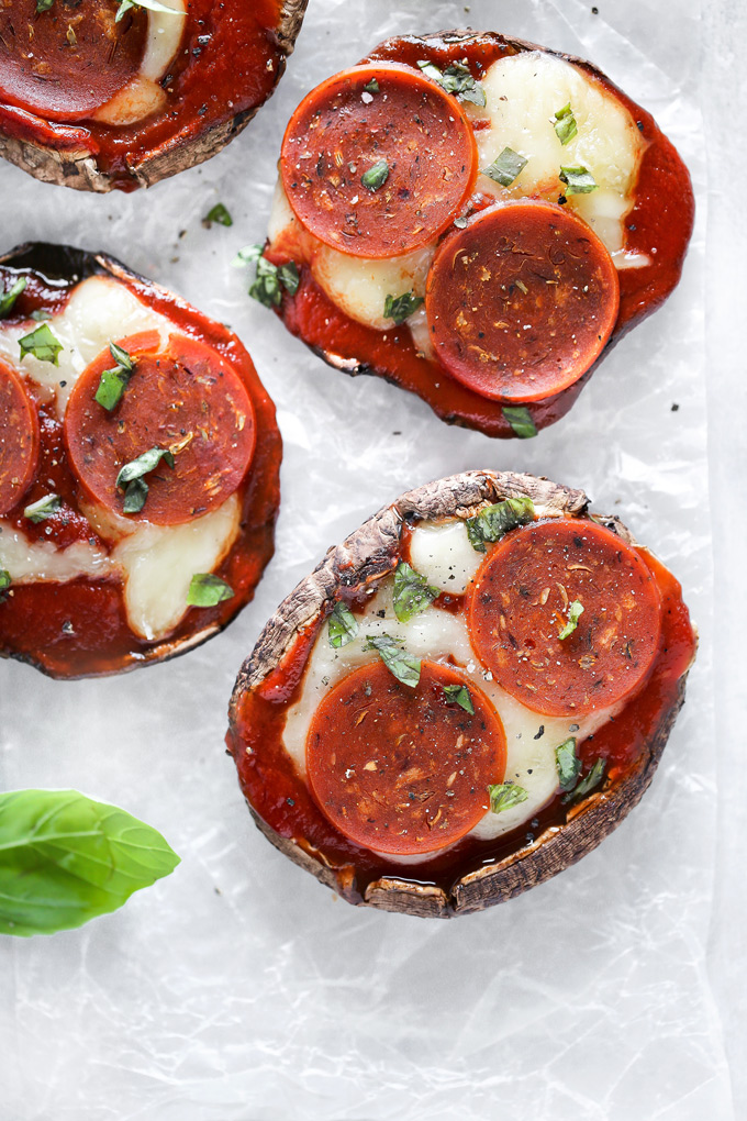 Vegan Keto Portobello Mushroom Pizzas are stuffed with vegan mozzarella, a keto friendly marinara sauce thats sugar free and topped with vegan pepperoni and sprinkles of basil. Perfect for your keto meals and hits the spot with pizza cravings! NeuroticMommy.com #keto #vegan