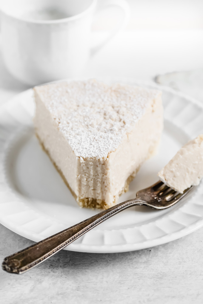 Vegan Keto Classic Style Cheesecake - A creamy plain cheesecake with a delicious buttery crust. Super easy and will be eaten by anyone, it's that good. Neuroticmommy.com #vegan #veganketo #cheesecake #christmas #holidays